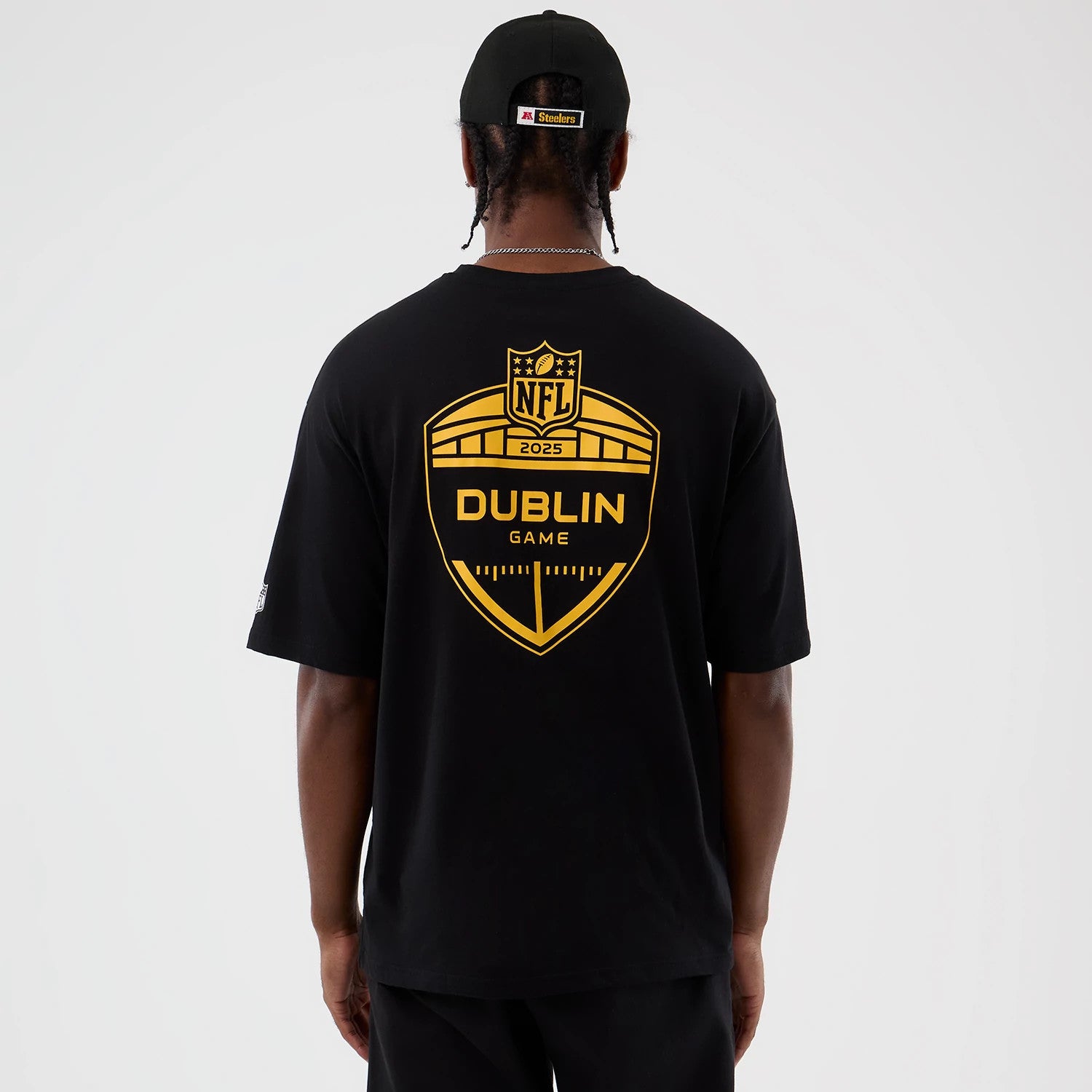The Male model is wearing Pittsburgh Steelers NFL International Series Games Black Oversized T-Shirt 2