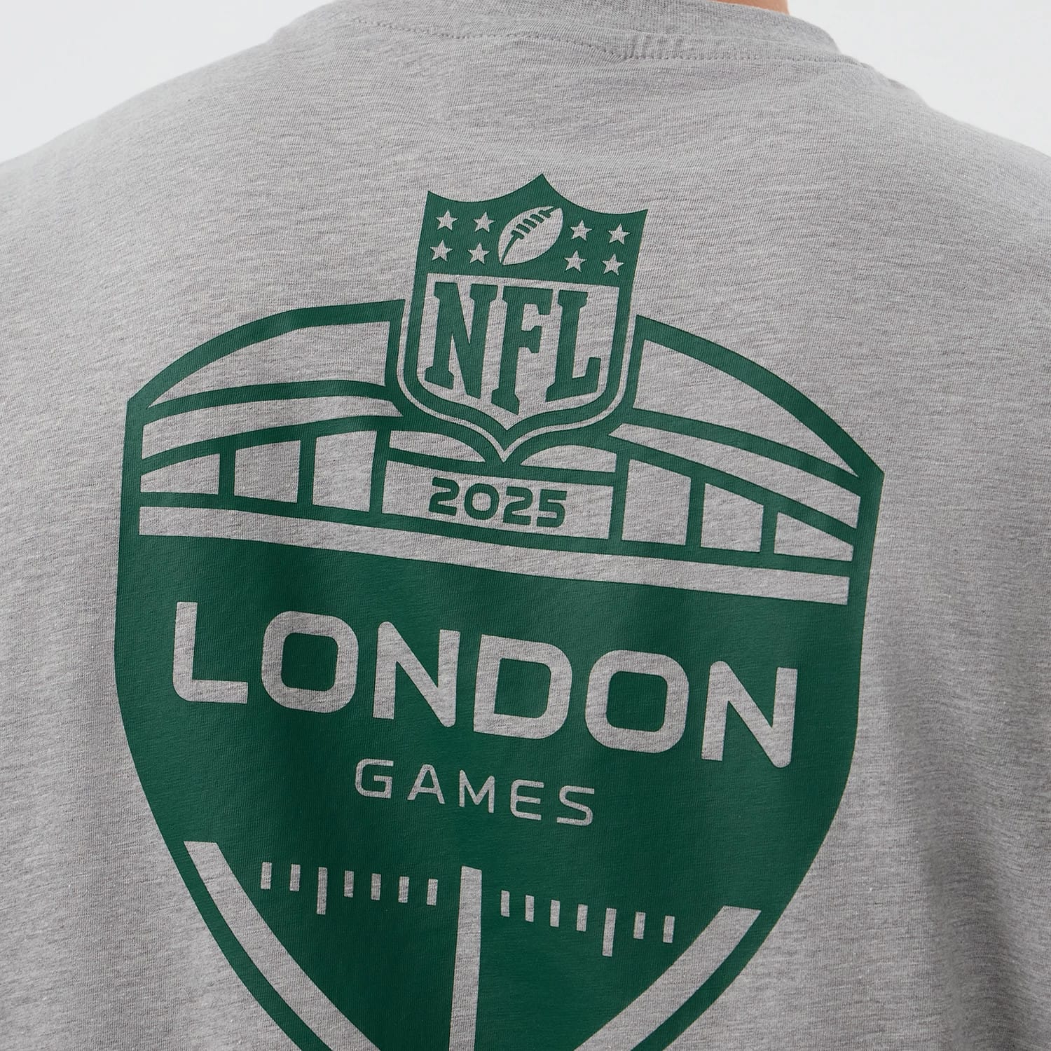 The Male model is wearing New York Jets NFL International Series Games Grey Oversized T-Shirt 4
