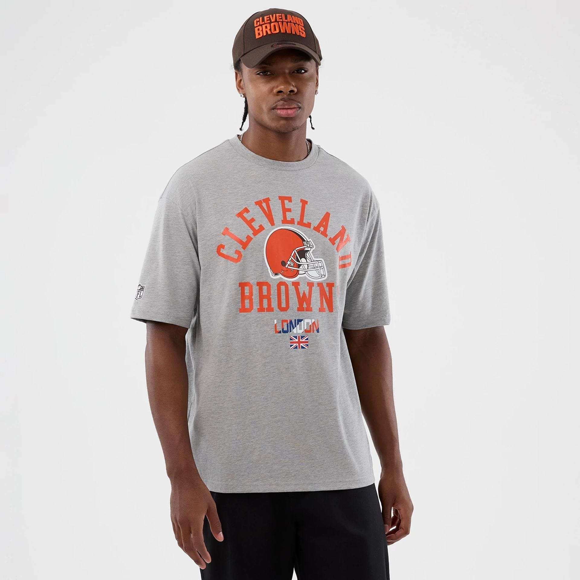 The Male model is wearing Cleveland Browns NFL International Series Games Grey Oversized T-Shirt 1