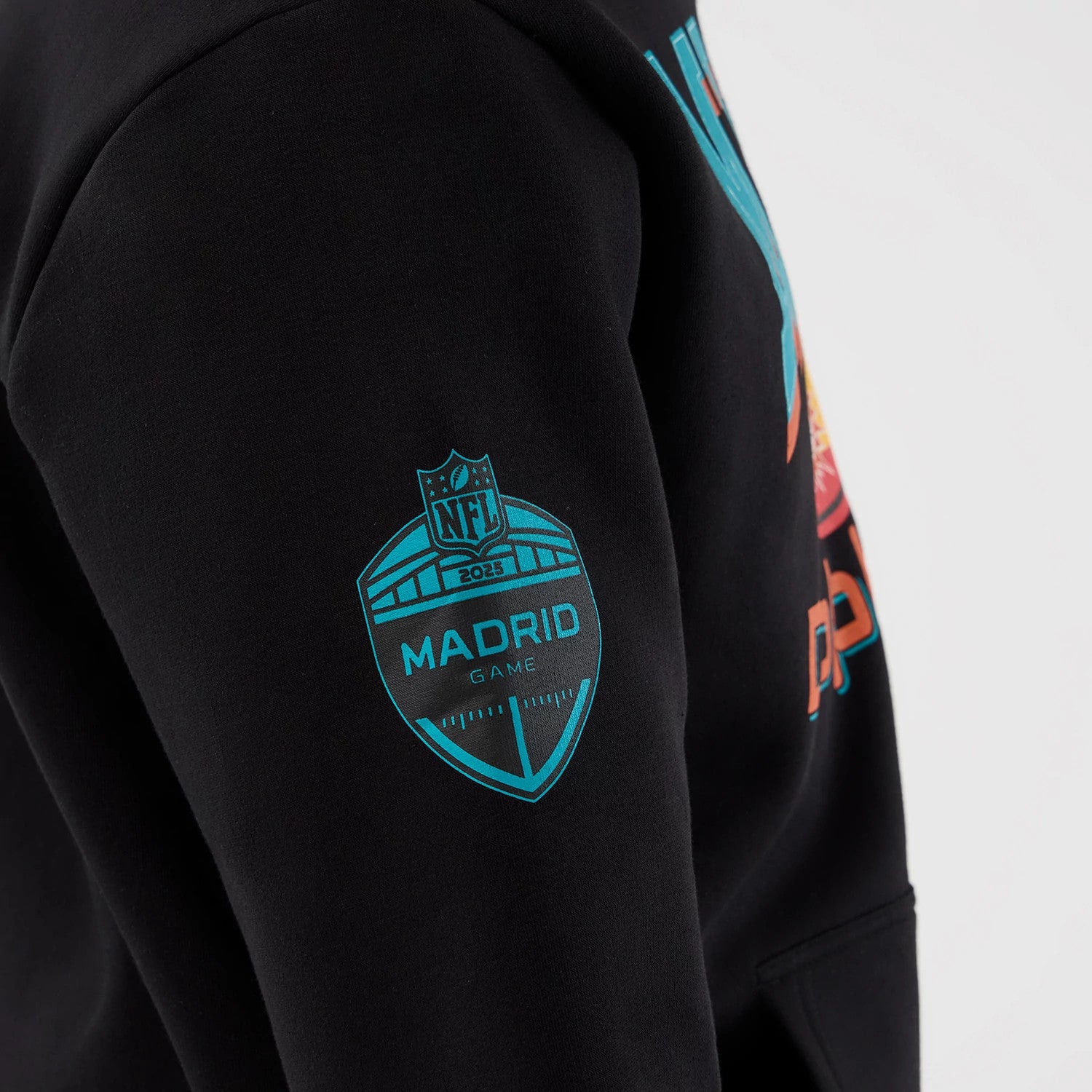 The Male model is wearing Miami Dolphins NFL International Series Games Patch Black Pullover Hoodie 4