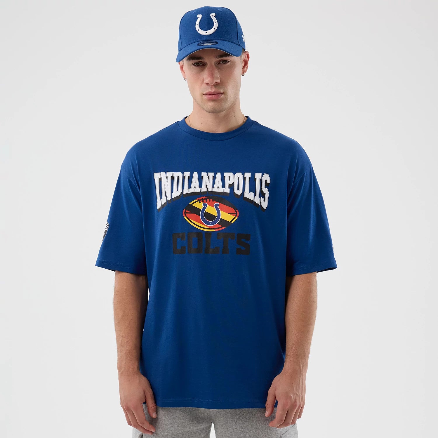 The Male model is wearing Indianapolis Colts NFL International Series Games Script Blue Oversized T-Shirt 1