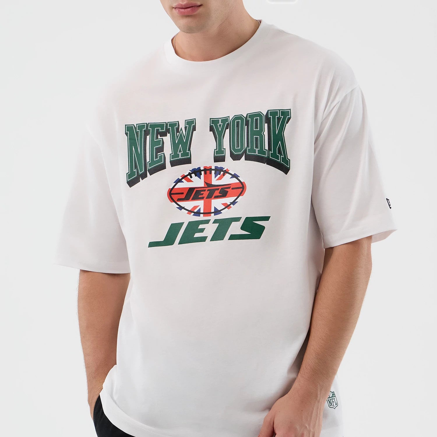 The Male model is wearing New York Jets NFL International Series Games White Oversized T-Shirt 3