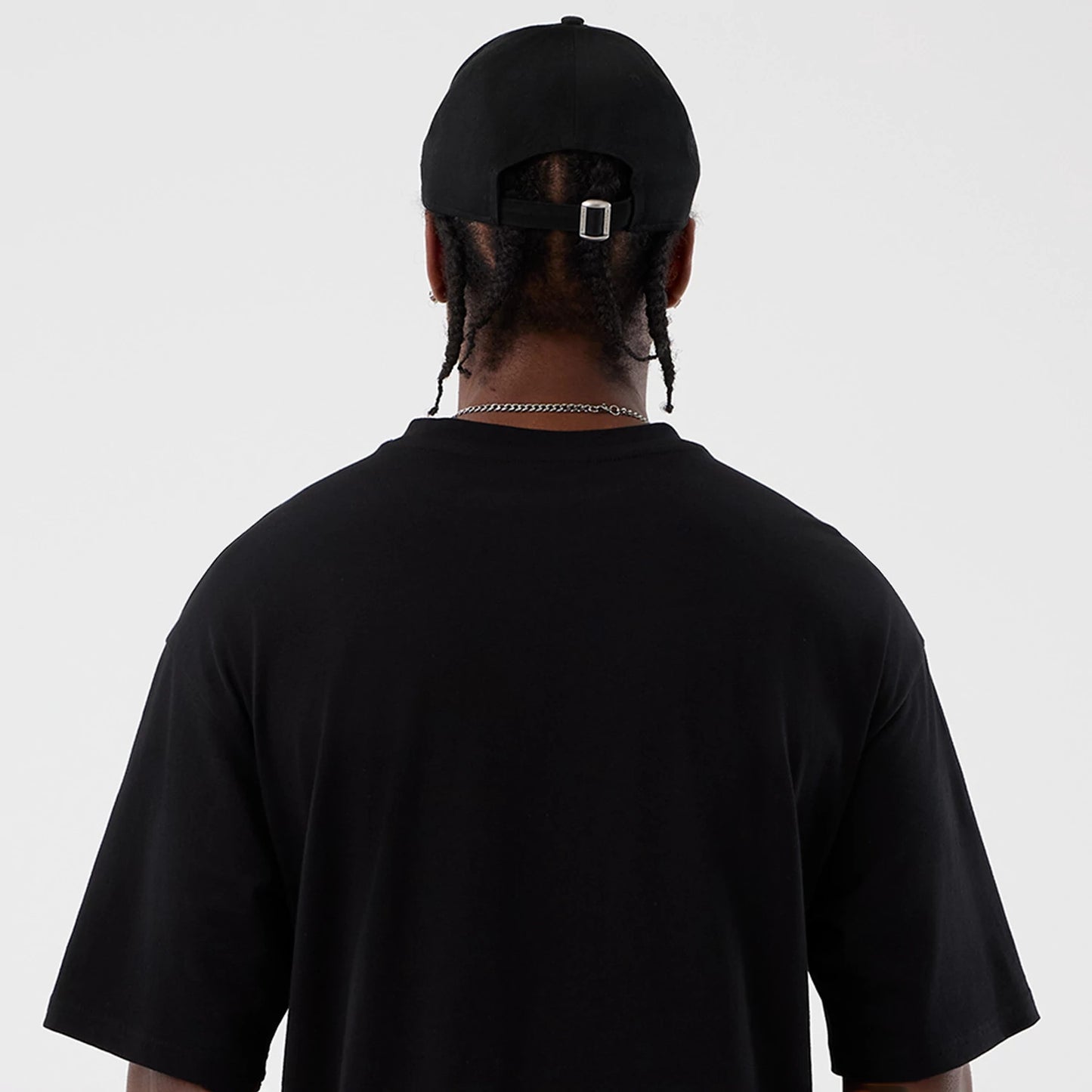 The Male model is wearing Berlin NFL International Series Games Black Oversized T-Shirt 7