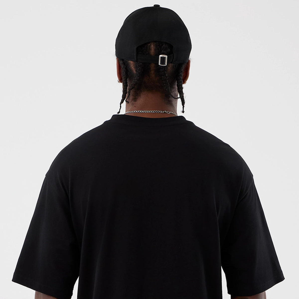 The Male model is wearing Berlin NFL International Series Games Black Oversized T-Shirt 7