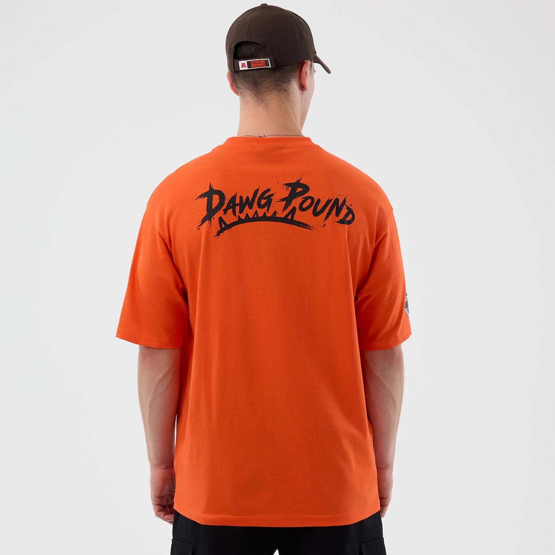 The Male model is wearing Cleveland Browns NFL International Series Games Orange Oversized T-Shirt 2