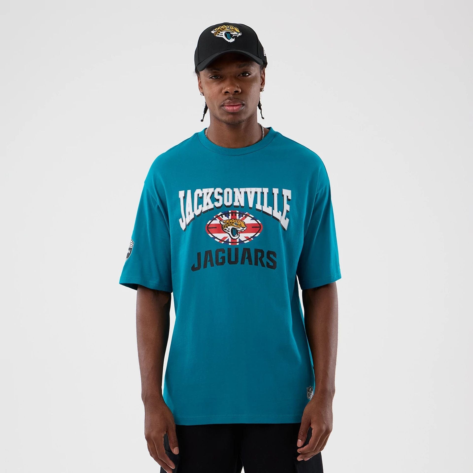 The Male model is wearing Jacksonville Jaguars NFL International Series Games Turquoise Oversized T-Shirt 1