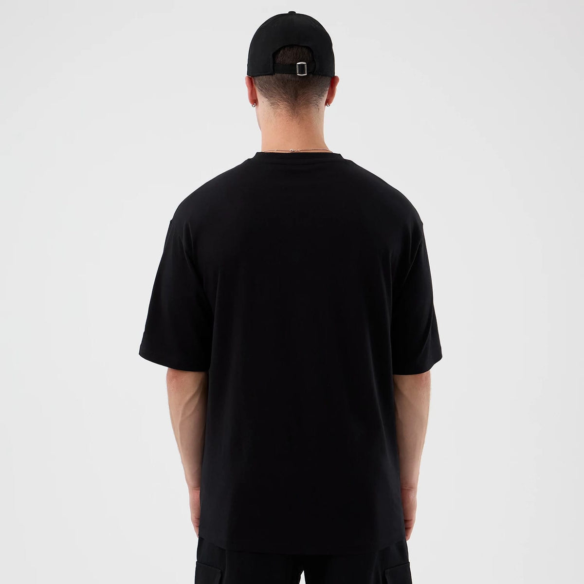 The Male model is wearing London Games NFL International Series Games Black Oversized T-Shirt 2