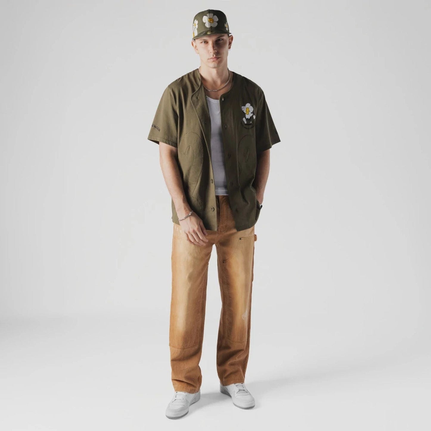 The Male model is wearing New Era x Rodrigo Roji Flower Green Jersey 7