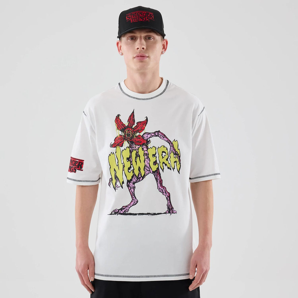 The Male model is wearing Stranger Things White Oversized T-Shirt 1