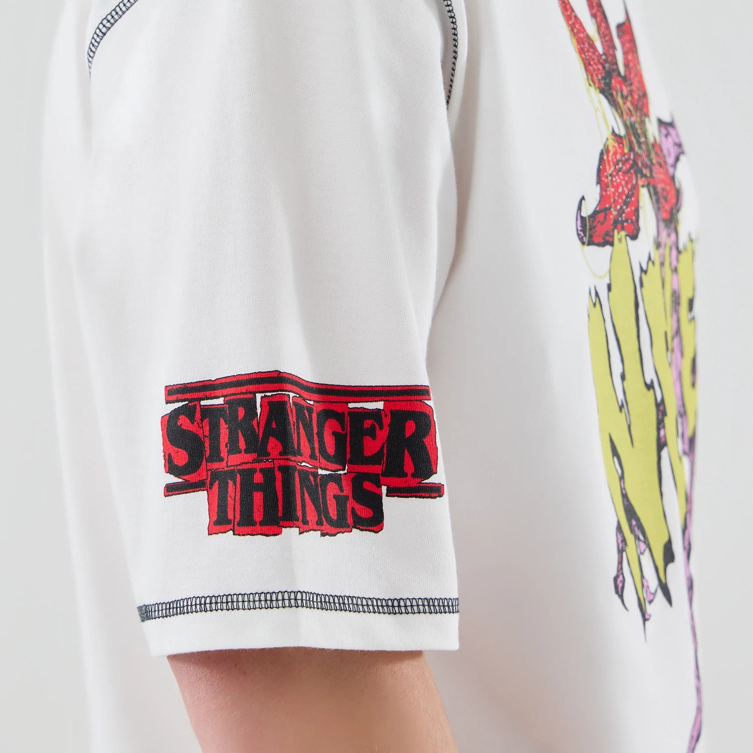 The Male model is wearing Stranger Things White Oversized T-Shirt 4