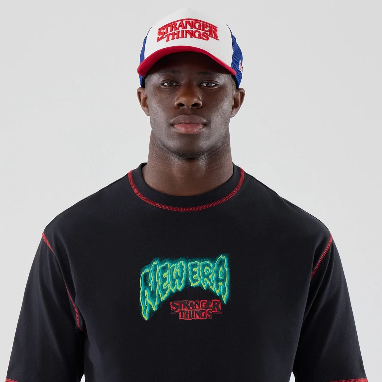 The Male model is wearing Stranger Things Black Oversized T-Shirt 7