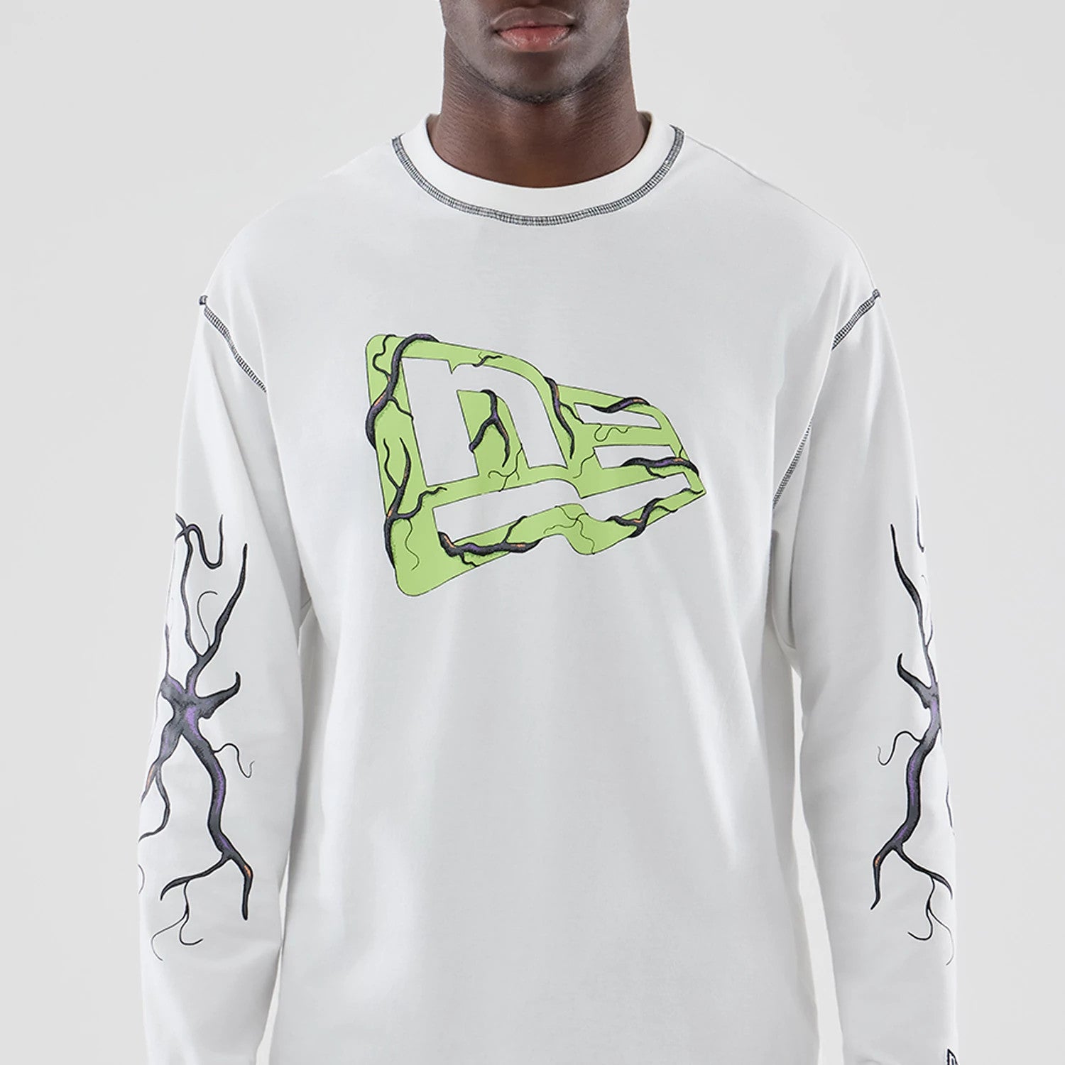 The Male model is wearing Stranger Things White Oversized Long Sleeve T-Shirt 3