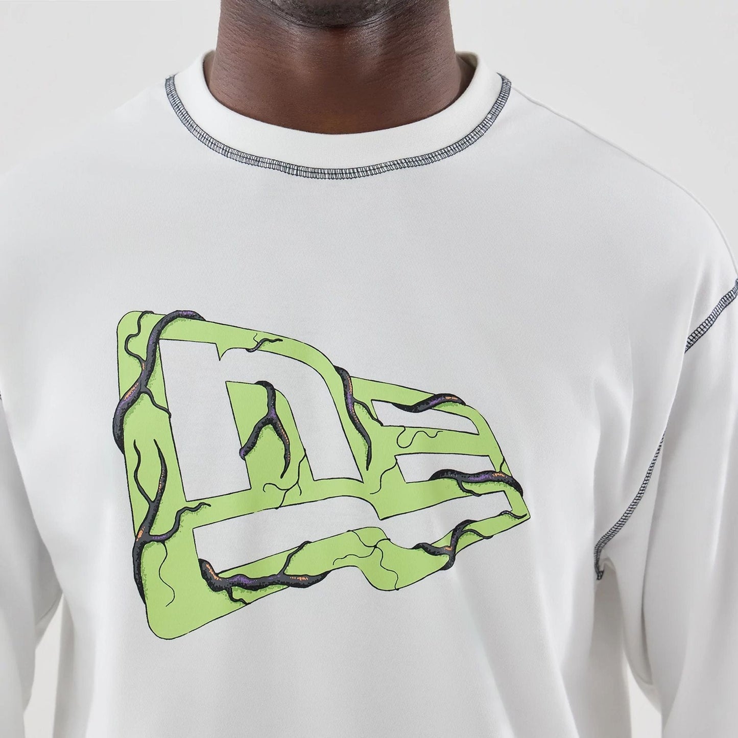 The Male model is wearing Stranger Things White Oversized Long Sleeve T-Shirt 7