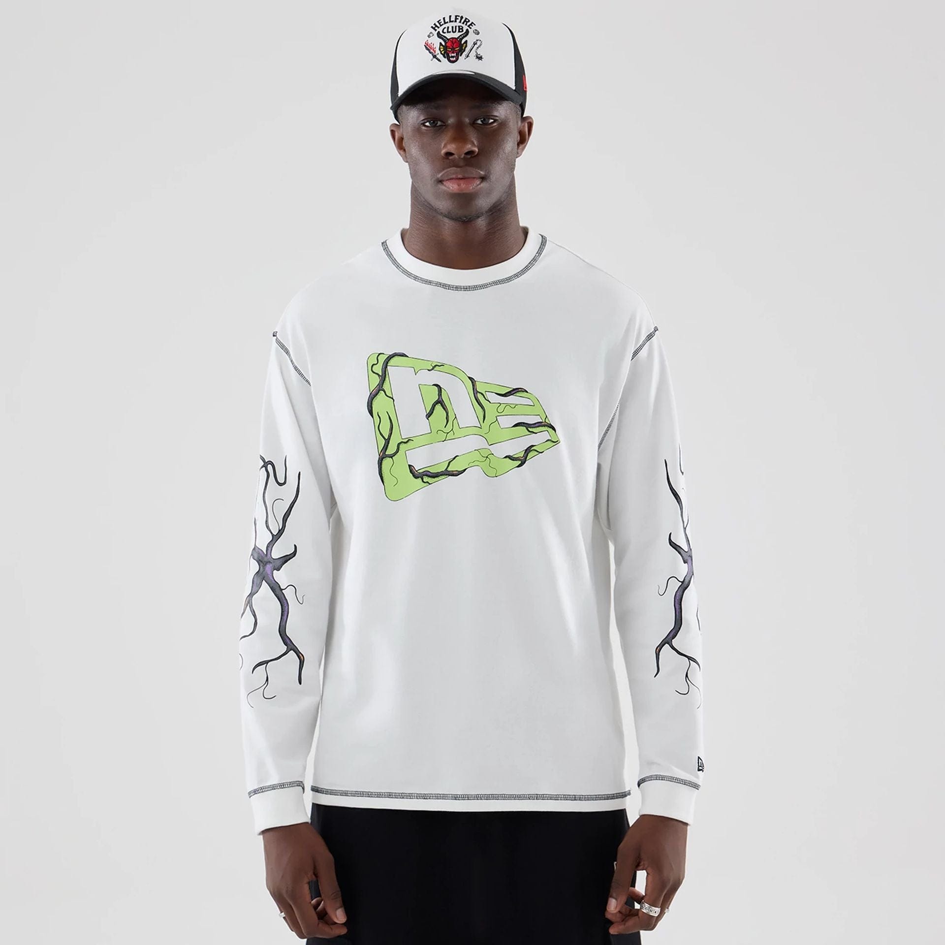 The Male model is wearing Stranger Things White Oversized Long Sleeve T-Shirt 1