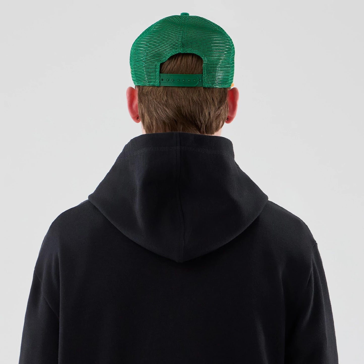The Male model is wearing Stranger Things Black Oversized Pullover Hoodie 7