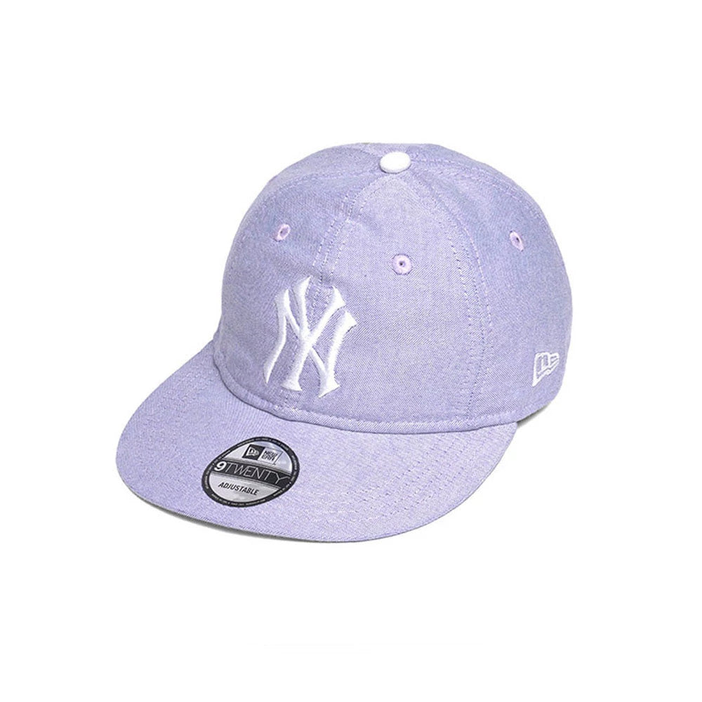 New York Yankees MLB Oxford Pastel Purple New Era 9TWENTY Long Visor Adjustable Cap, three-quarter view showing the raised white NY logo on the front panel, pastel purple crown and visor, with the 9TWENTY size sticker on the long visor.