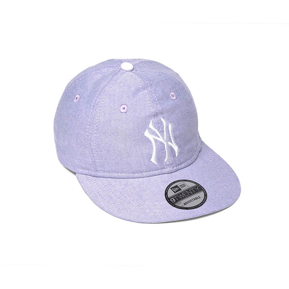 New York Yankees MLB Oxford Pastel Purple New Era 9TWENTY Long Visor Adjustable Cap, three-quarter view showing the white raised embroidered NY logo on the front panel, curved pastel purple visor, and 9TWENTY size sticker.