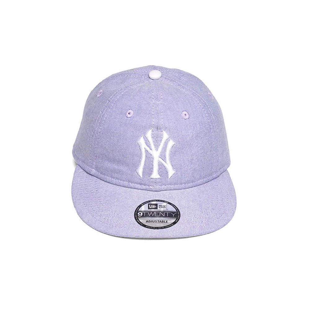 New York Yankees MLB Oxford Pastel Purple New Era 9TWENTY Long Visor Adjustable Cap, front view showing a raised white embroidered NY logo on the relaxed pastel purple crown with matching eyelets and a 9TWENTY size sticker on the visor.