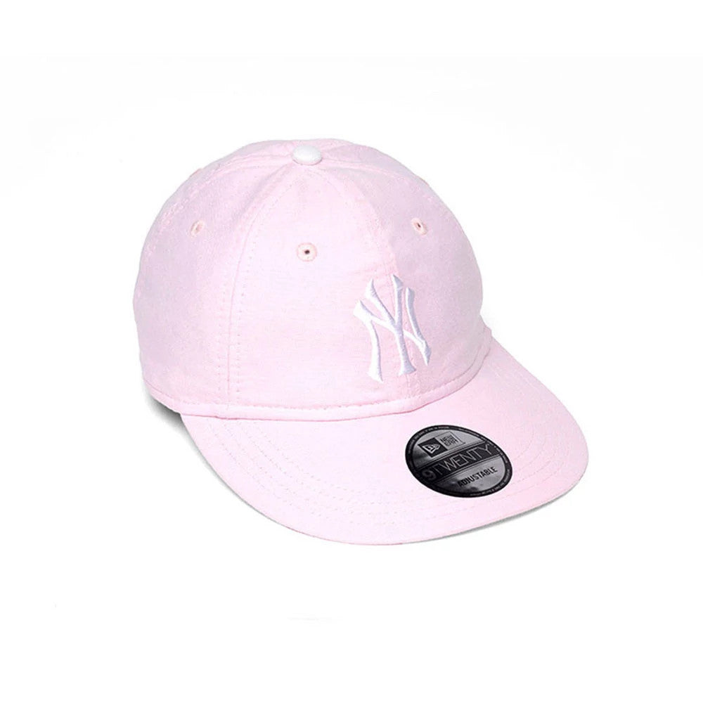New York Yankees MLB Oxford Pastel Pink New Era 9TWENTY Long Visor Adjustable Cap, three-quarter view showing the white embroidered NY logo on the structured crown, pastel pink long visor with a 9TWENTY size sticker, and matching top button.