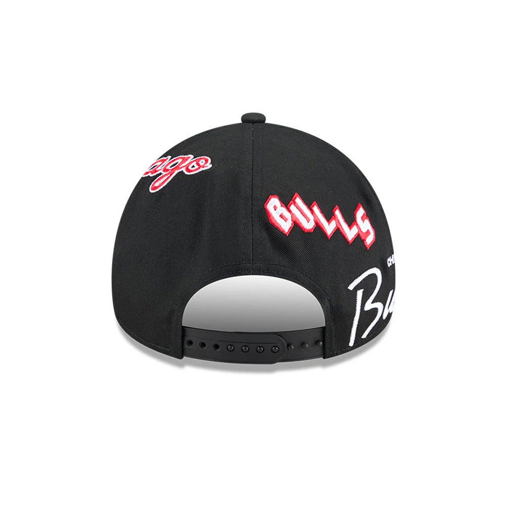 Chicago Bulls NBA All Over Black New Era 9FORTY A-Frame Adjustable Cap, rear view showing red and white embroidered Bulls logo on the black panels, with an open adjustable strap and multiple embroidered designs.