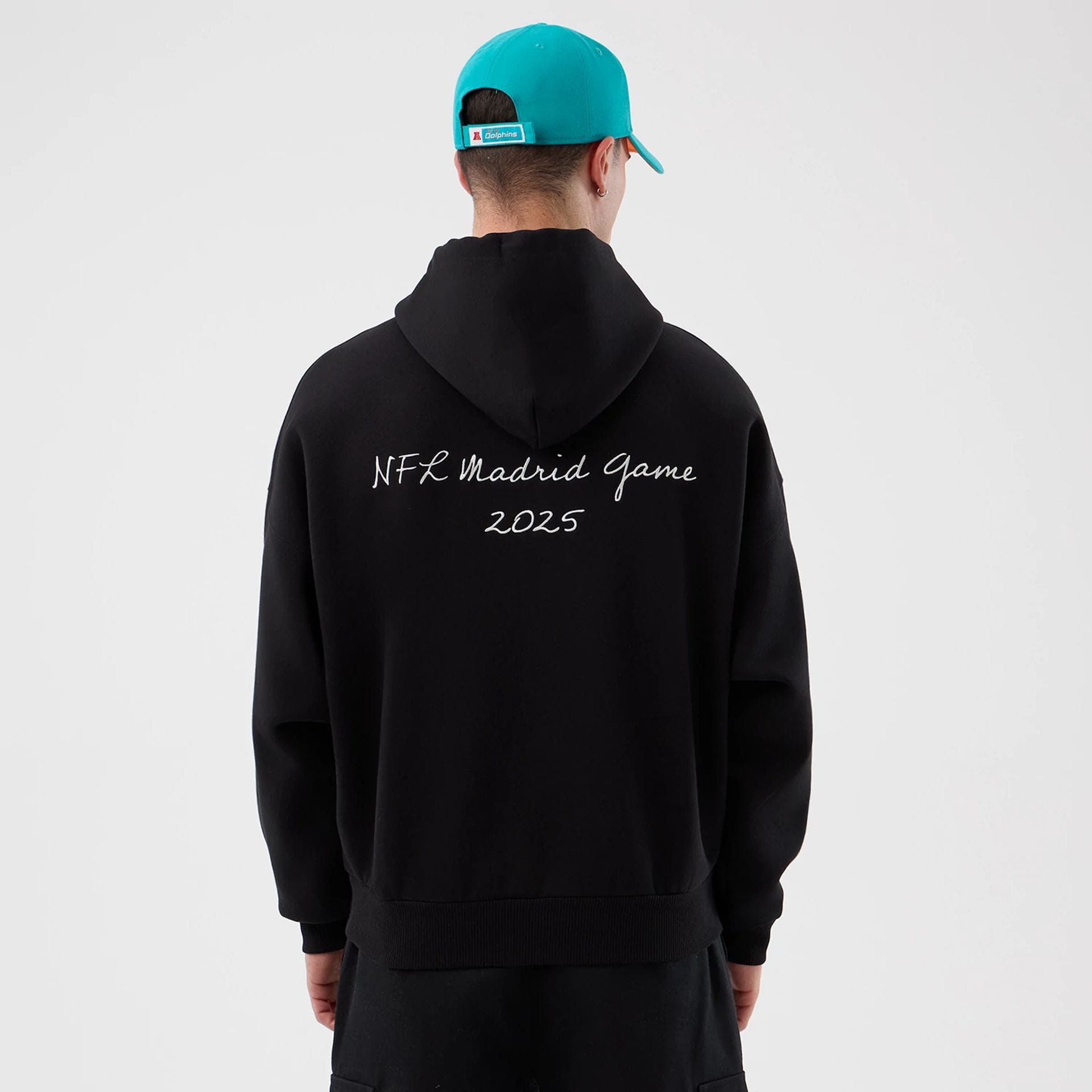 The Male model is wearing Miami Dolphins NFL International Series Games Black Pullover Hoodie 2