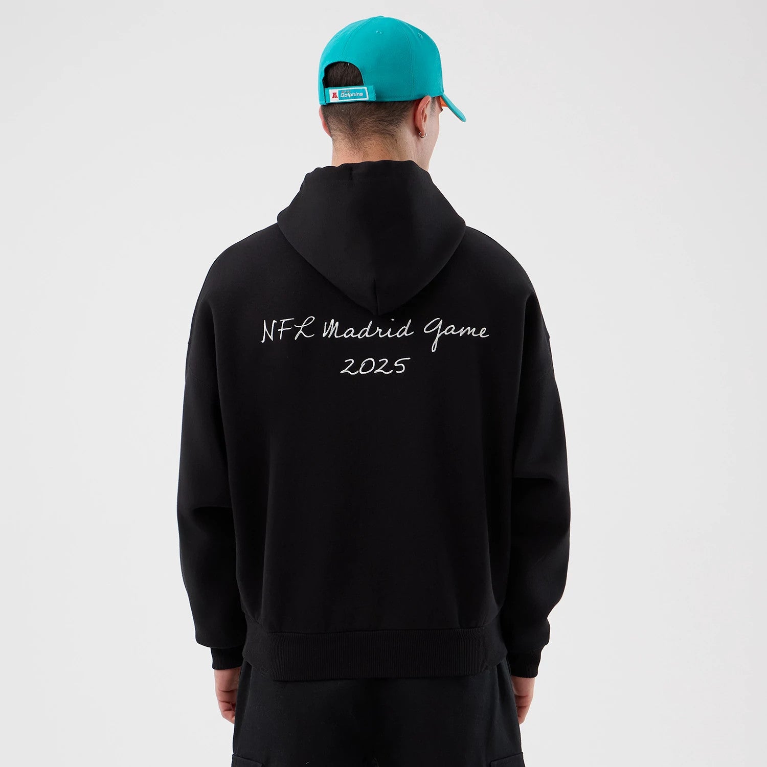 The Male model is wearing Miami Dolphins NFL International Series Games Black Pullover Hoodie 2