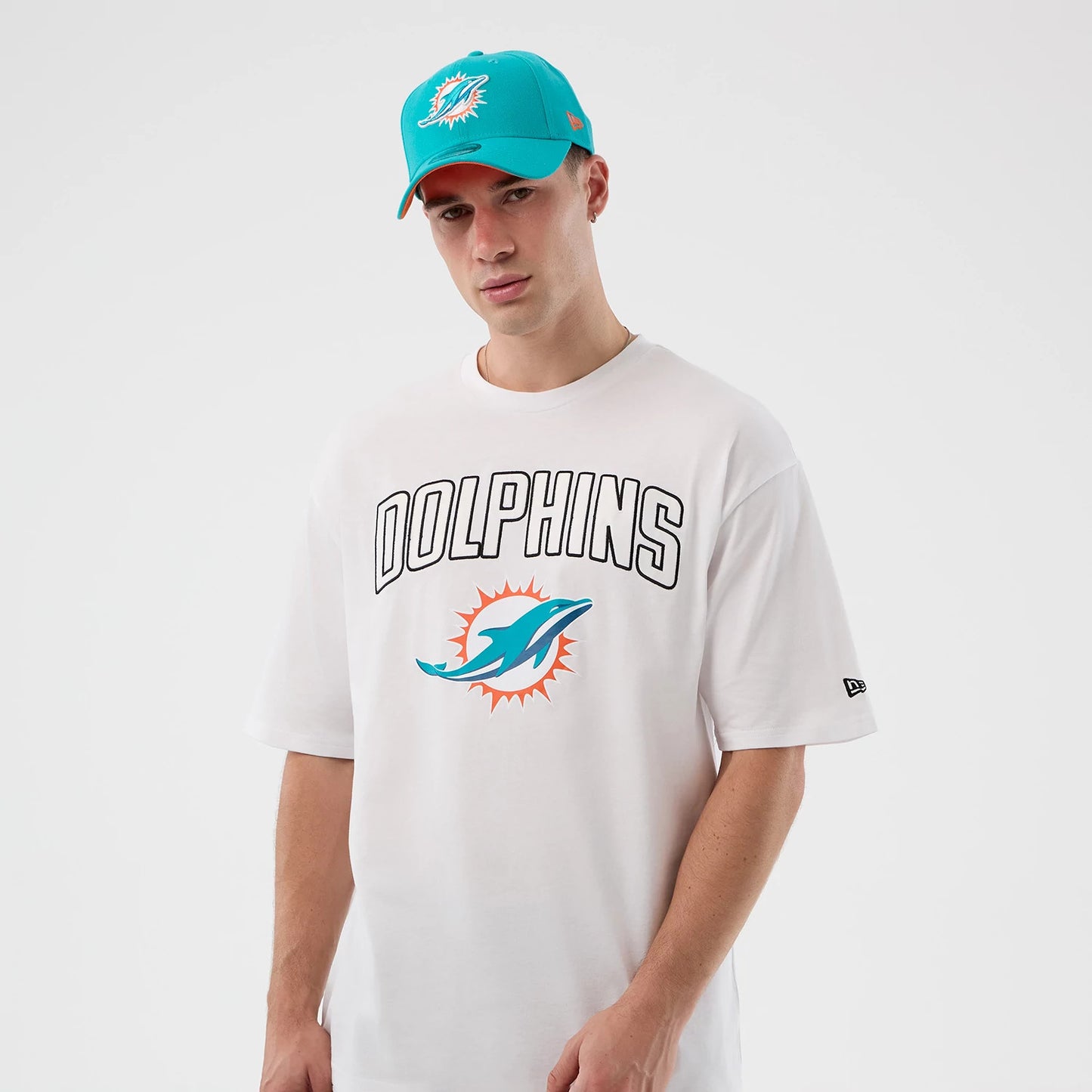 The Male model is wearing Miami Dolphins NFL International Series Games Script White Oversized T-Shirt 7