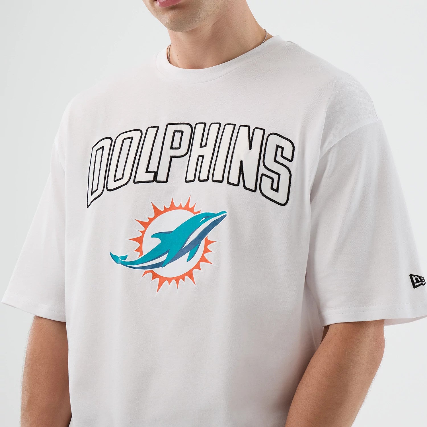 The Male model is wearing Miami Dolphins NFL International Series Games Script White Oversized T-Shirt 3