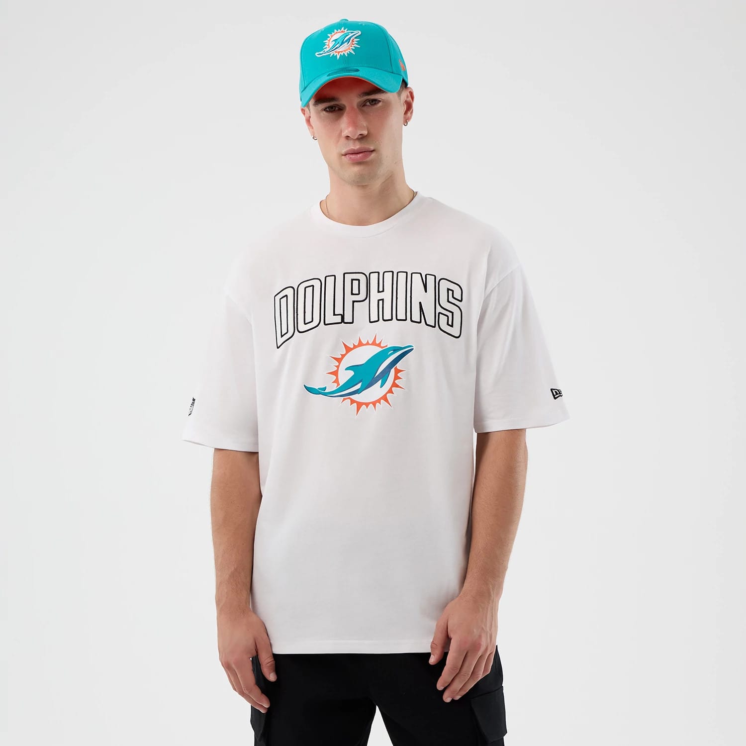 The Male model is wearing Miami Dolphins NFL International Series Games Script White Oversized T-Shirt 1