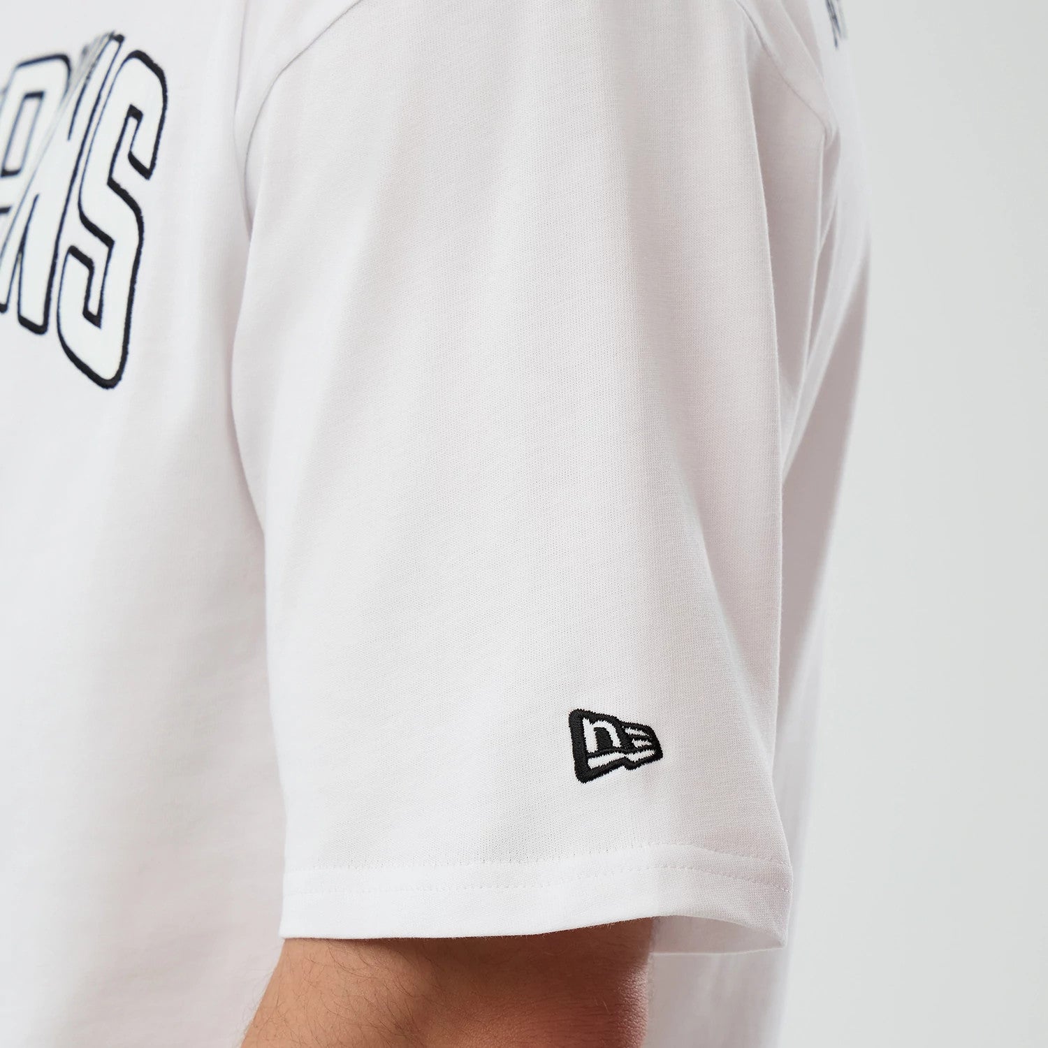 The Male model is wearing Miami Dolphins NFL International Series Games Script White Oversized T-Shirt 4