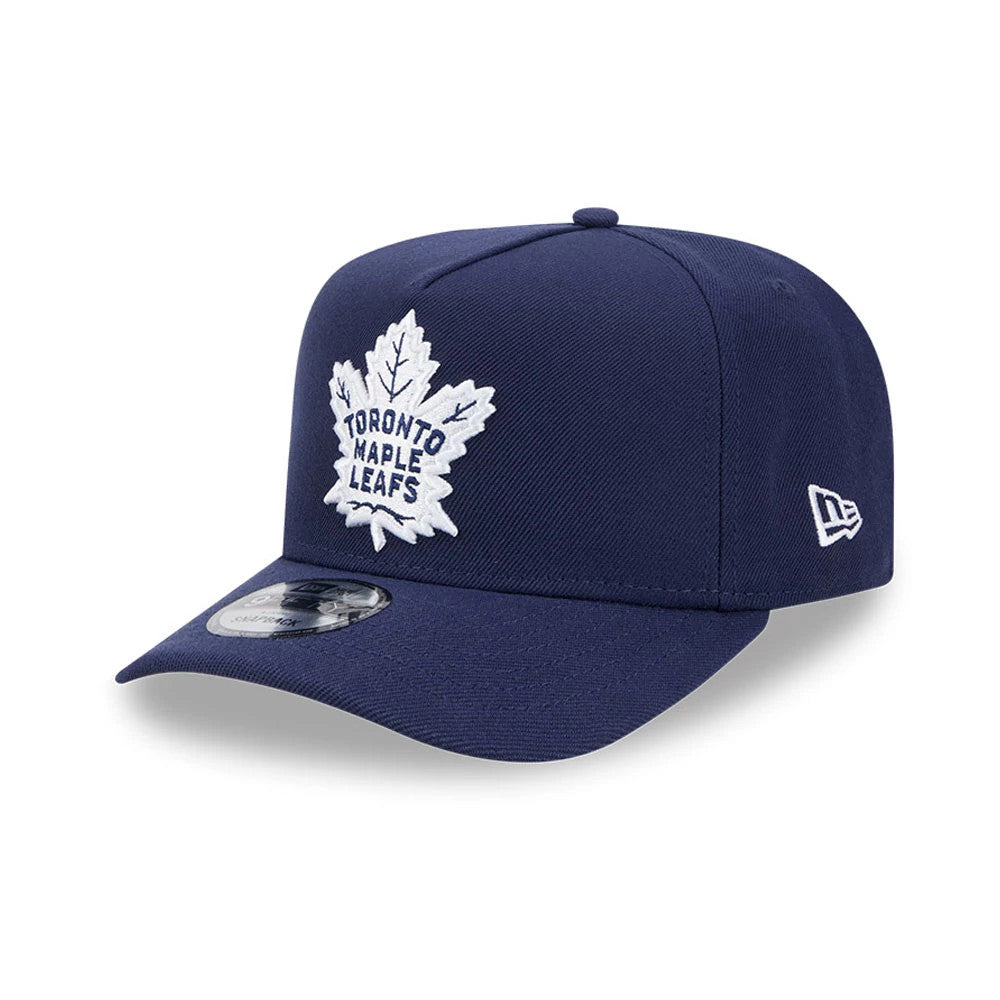 Maple Leafs NHL Evergreen Navy New Era 9FIFTY A-Frame Snapback Adjustable Cap, three-quarter view showing the raised white embroidered leaf logo on the front panel, matching navy flat visor and the New Era flag logo on the left side.