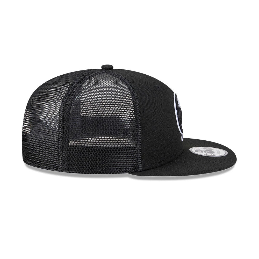 New York Yankees MLB Evergreen Black New Era 9FIFTY Trucker Adjustable Cap, side view showing the white embroidered Yankees logo on the front panel, black mesh back panels, and a black flat visor with a 9FIFTY size sticker.