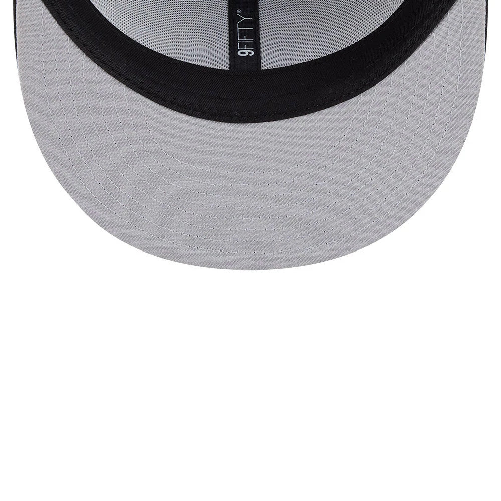 New York Yankees MLB Evergreen Black New Era 9FIFTY Trucker Adjustable Cap, inside view showing a grey undervisor with stitching and 9FIFTY label on the black taping running down the centre.