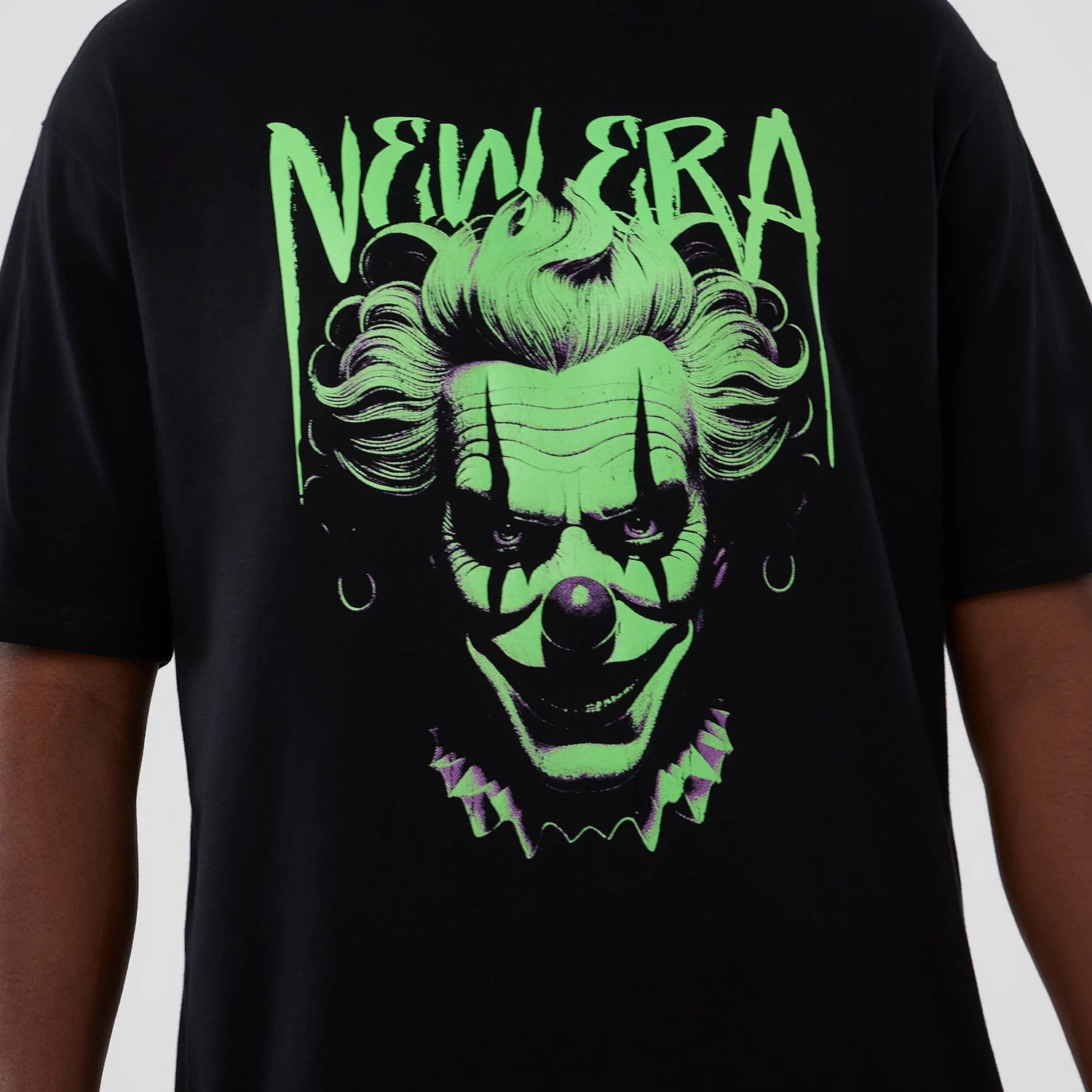 The Male model is wearing New Era Halloween Clown Graphic Black Oversized T-Shirt 3