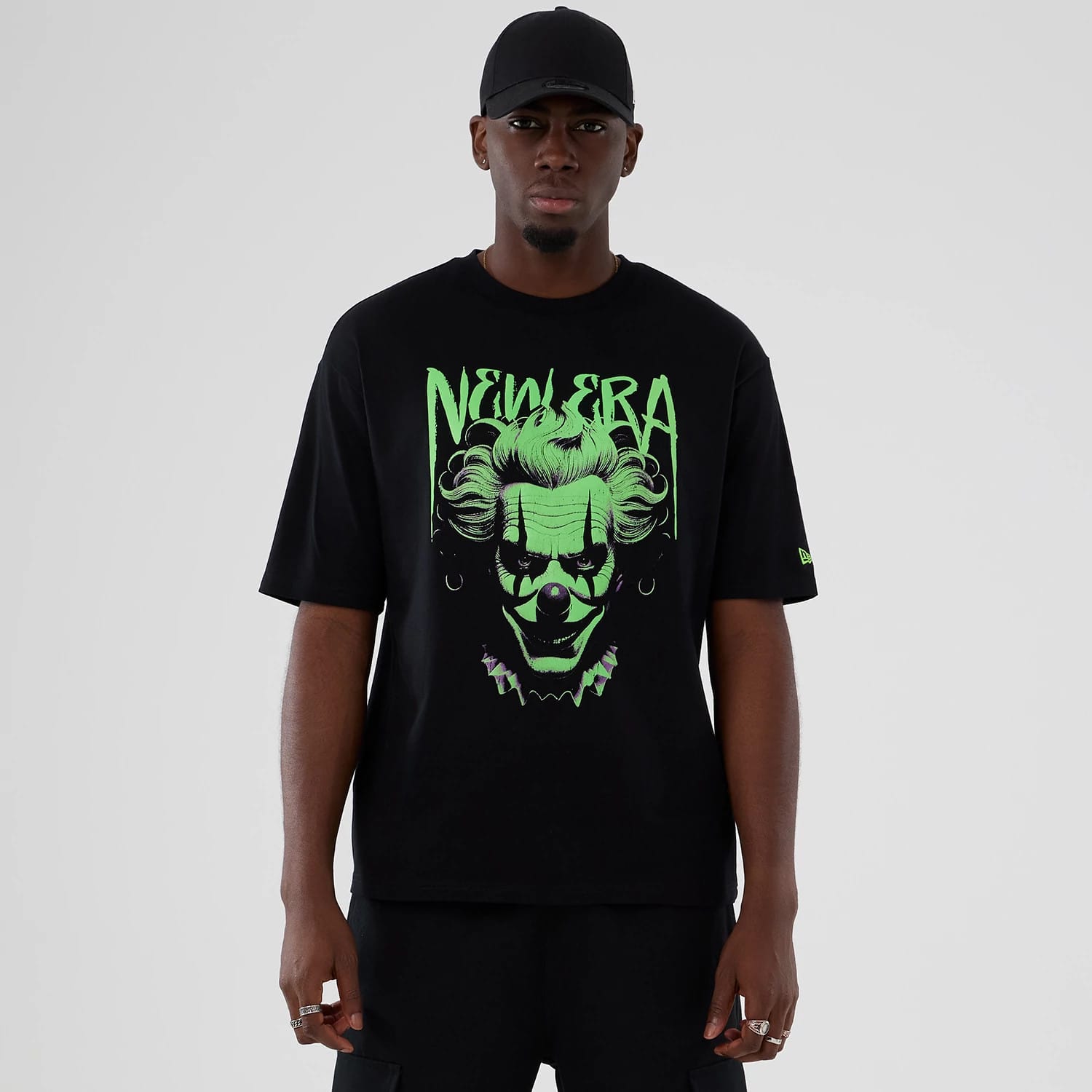 The Male model is wearing New Era Halloween Clown Graphic Black Oversized T-Shirt 1