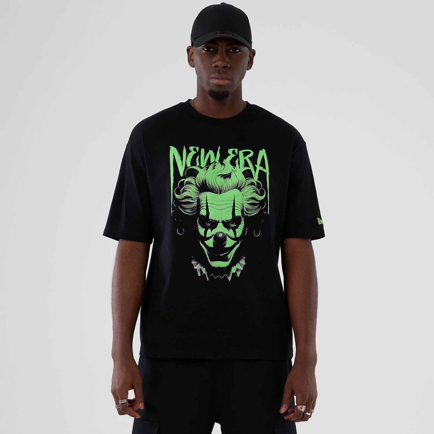 The Male model is wearing New Era Halloween Clown Graphic Black Oversized T-Shirt 1
