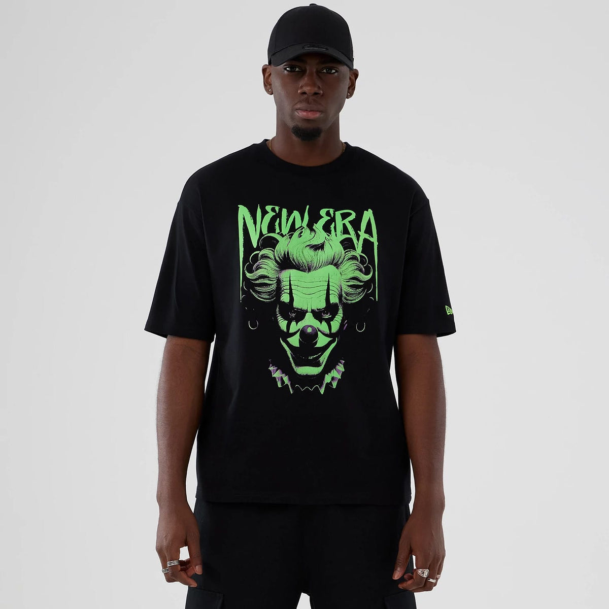 The Male model is wearing New Era Halloween Clown Graphic Black Oversized T-Shirt 1