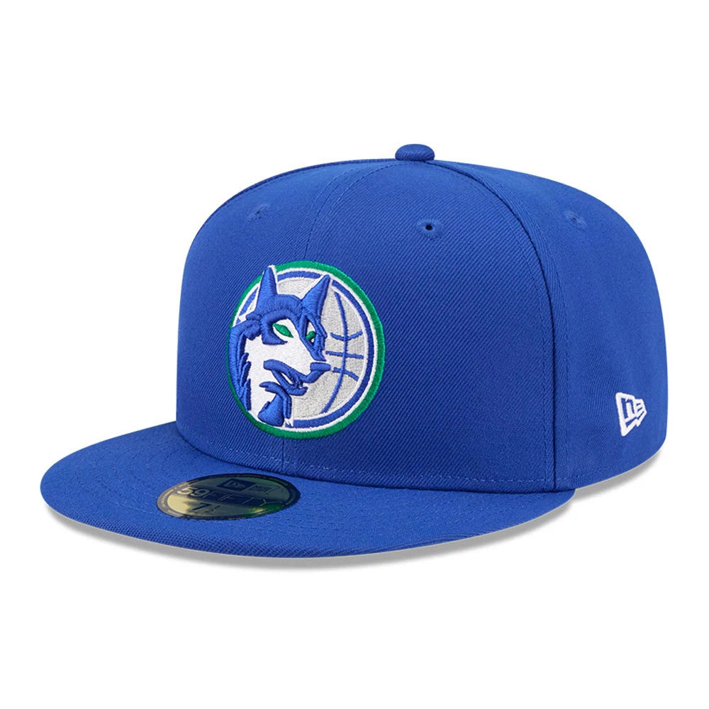 Minnesota Timberwolves NBA Hardwood Classic Blue New Era 59FIFTY Fitted Cap, three-quarter view showing the blue and green embroidered Timberwolves logo on the front panel, flat blue visor with gold 59FIFTY size sticker.