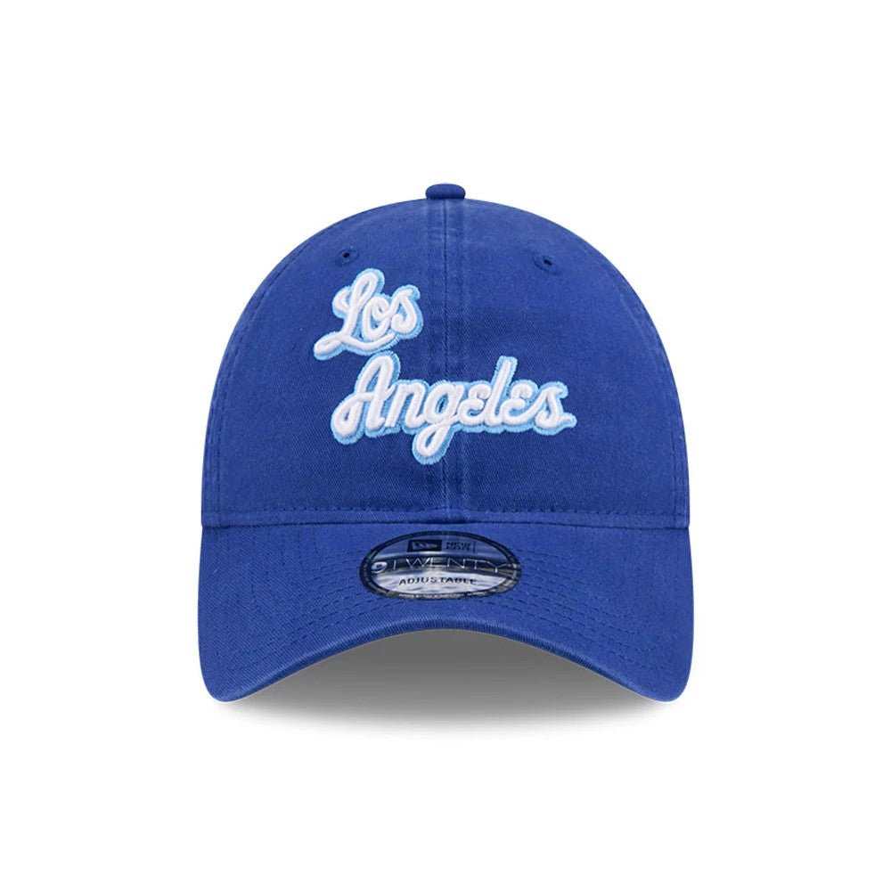 LA Lakers NBA Hardwood Classic Blue New Era 9TWENTY Adjustable Cap, front view showing the white raised embroidered Los Angeles script on the unstructured blue crown, with the 9TWENTY size sticker on the curved visor.