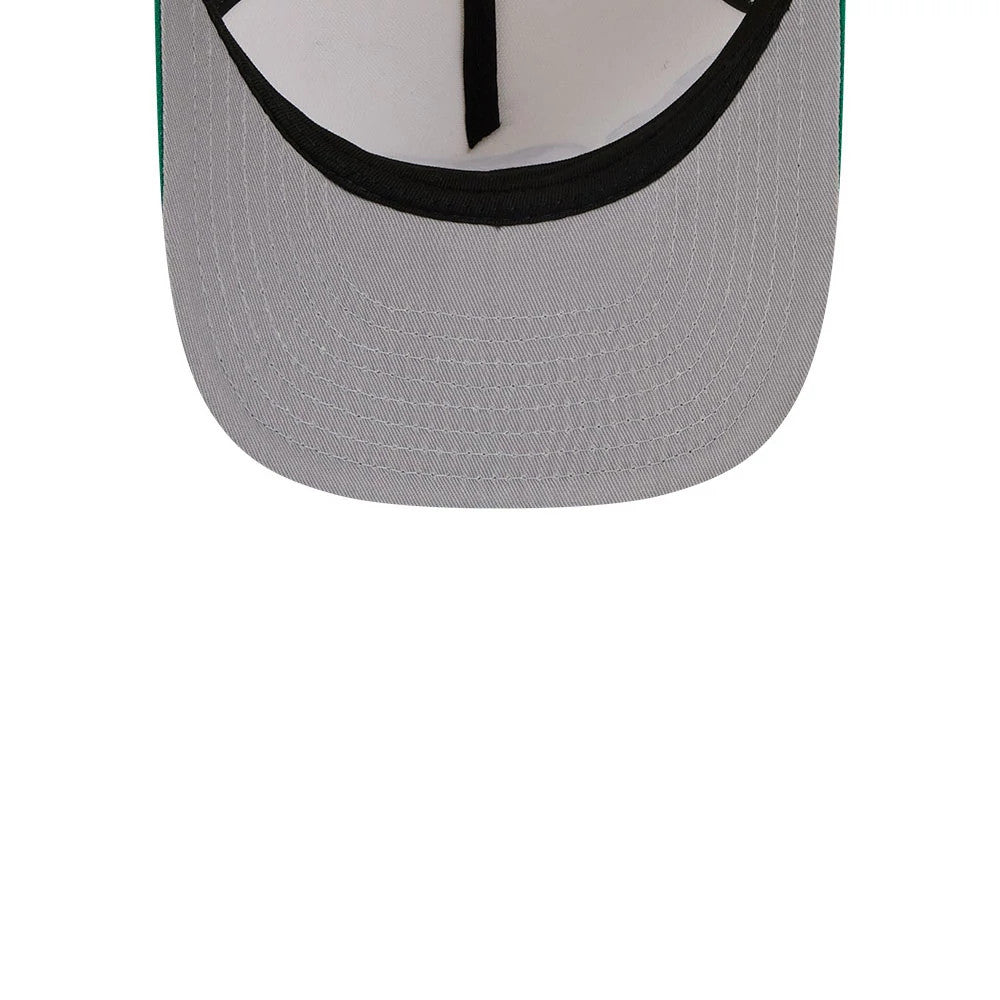 Boston Celtics NBA Cream New Era 9FIFTY A-Frame Snapback Adjustable Cap, inside view showing the grey undervisor, black sweatband, white inner lining, and black taping, providing a glimpse of the construction details.