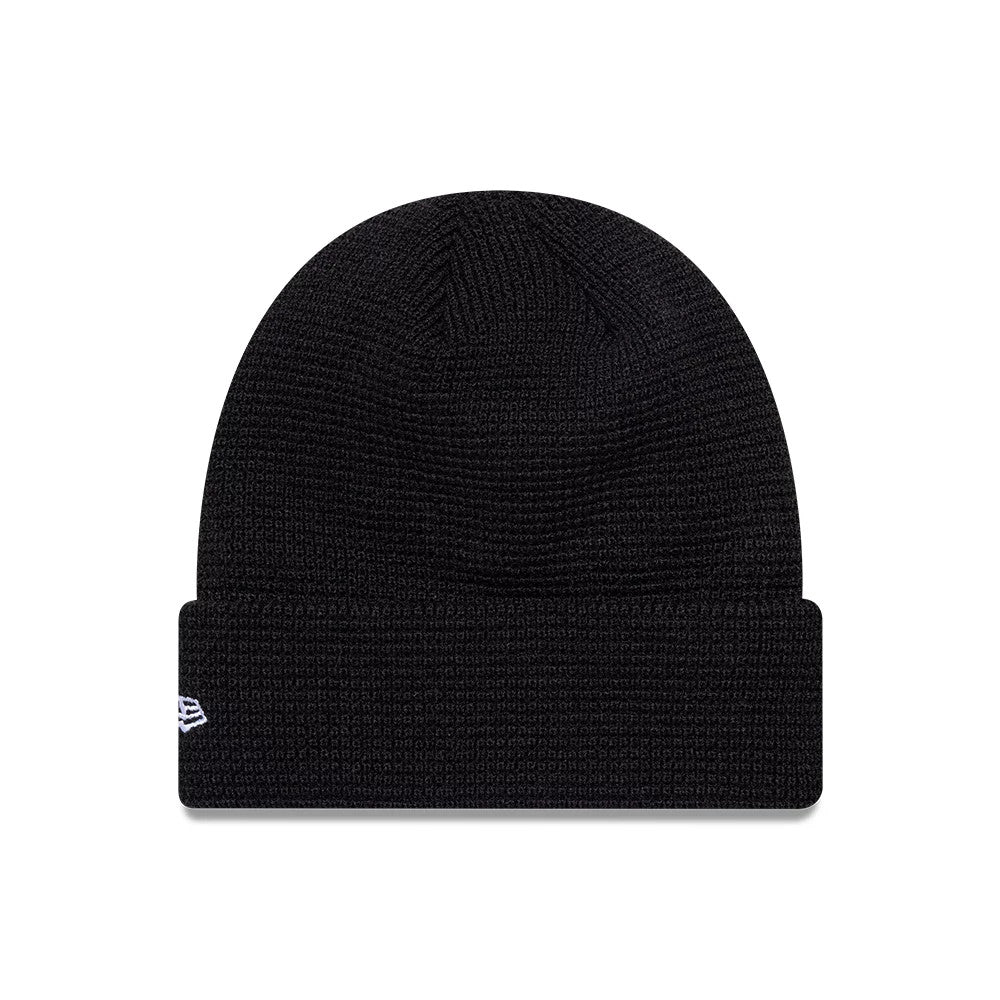 New Era Newcastle United FC Waffle Black Cuff knit Beanie Hat, front view showing a textured black waffle knit crown and cuff, with the white embroidered New Era flag logo on the left side of the cuff.