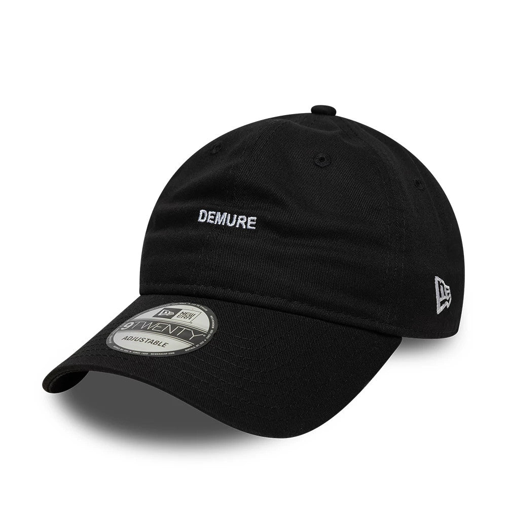 This is a New Era Slogan Demure Black 9TWENTY Adjustable Cap 1