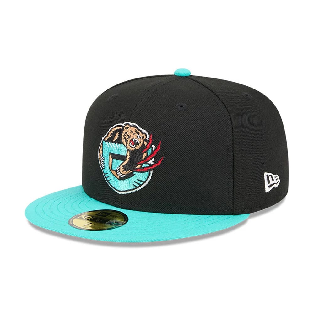 Memphis Grizzlies NBA Classic Black New Era 59FIFTY Fitted Cap, three-quarter view showing the turquoise embroidered bear logo on the front panel, a matching turquoise flat visor, and a gold 59FIFTY size sticker.