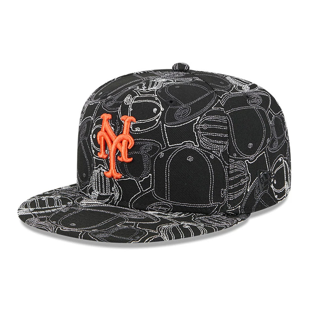 New York Mets MLB Cap Scramble Black New Era 59FIFTY Fitted Cap, three-quarter view showing an orange embroidered Mets logo on the structured black crown with a scramble pattern of outlined caps, black visor.