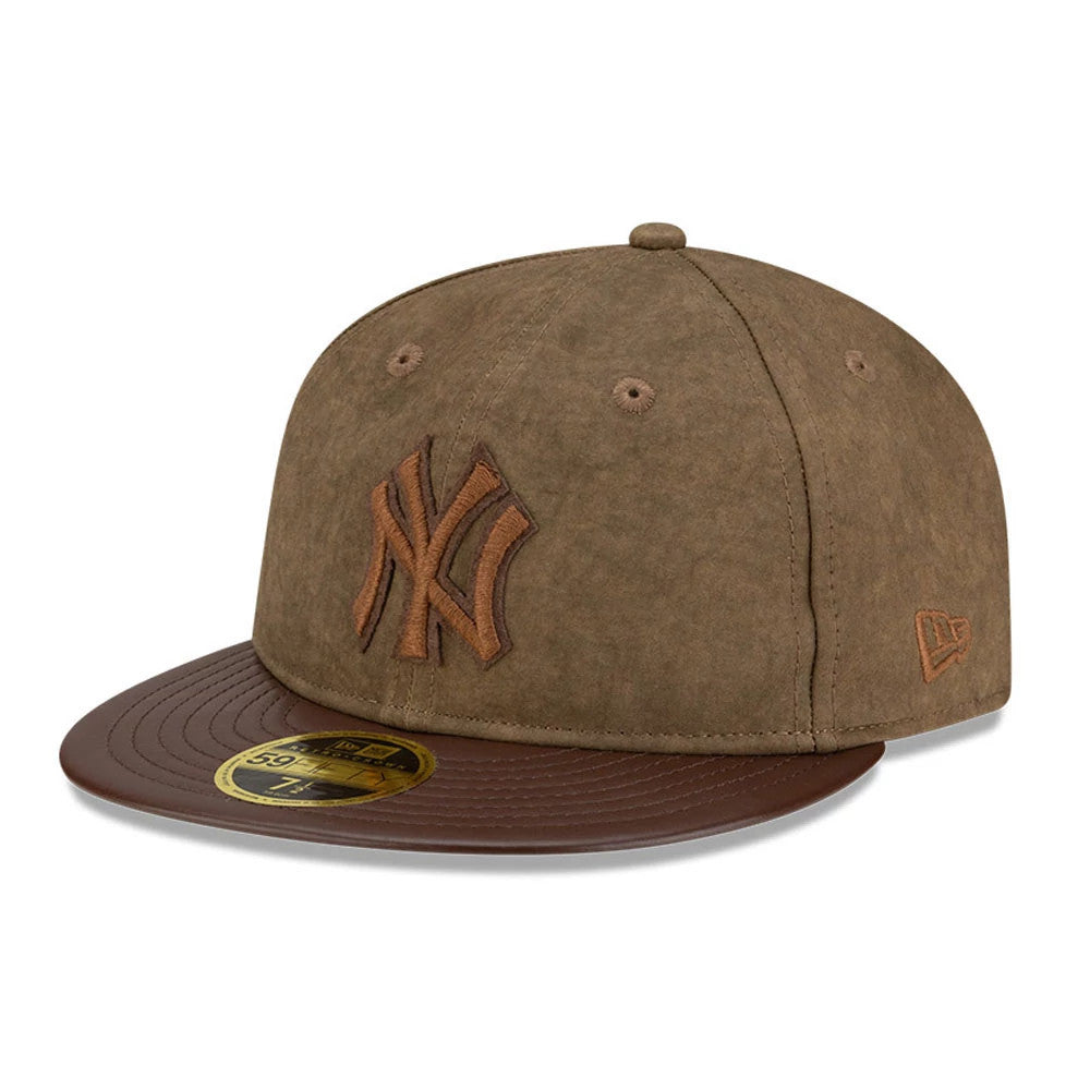 New York Yankees MLB Open Brown Retro Crown New Era 59FIFTY Fitted Cap, three-quarter view showing the brown embroidered NY logo on the front panel, dark brown flat visor with gold 59FIFTY size sticker, and New Era flag logo on the left side.