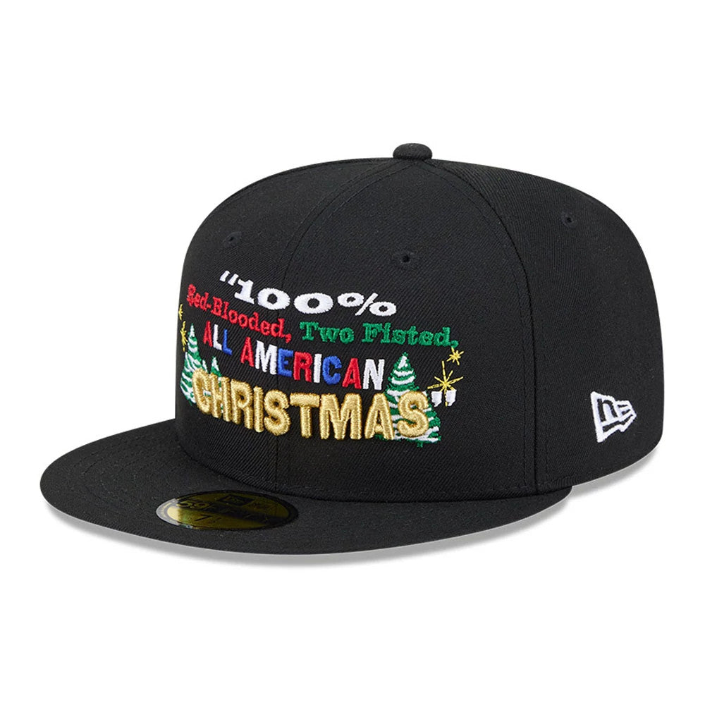 A Christmas Story Warner Brothers Black New Era 59FIFTY Fitted Cap, three-quarter view showing multicoloured raised embroidery with 100% Red-Blooded, Two Fisted, All American Christmas text, a black visor and the New Era flag logo on the left side.