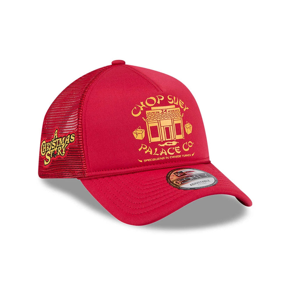 A Christmas Story Red New Era 9FORTY A-Frame Trucker Adjustable Cap, three-quarter view showing the yellow raised embroidery of Chop Suey Palace on the front panel and an A Christmas Story logo on the red mesh side panel.