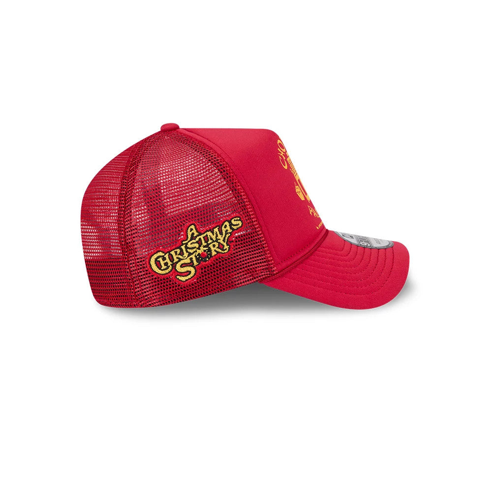 A Christmas Story Red New Era 9FORTY A-Frame Trucker Adjustable Cap, side view showing the embroidered A Christmas Story logo in yellow on the red mesh panels, with a curved red visor and a 9FORTY size sticker.