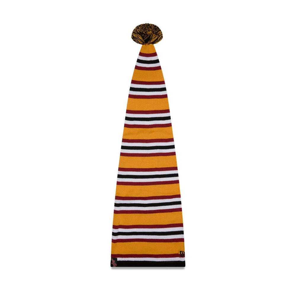 New Era A Christmas Story Warner Brothers Black Cuff Knit Beanie Hat, front view showing the black cuff with an embroidered New Era flag logo and a full-length striped pattern in orange, white, and maroon, topped with a black and gold pom-pom.