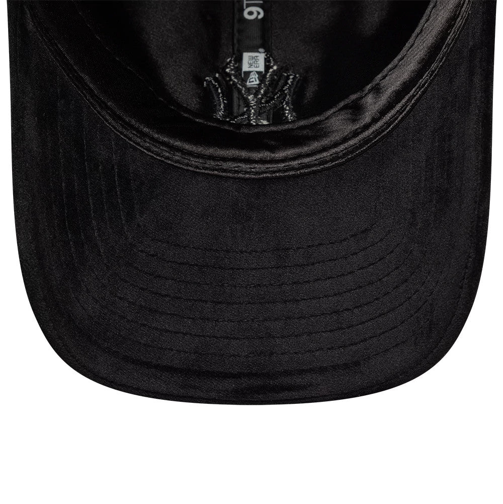 New York Yankees MLB Velour Black New Era 9TWENTY Bow Back Adjustable Cap, inside view showing the black undervisor and black taping with New Era branding, highlighting the velour texture and adjustable strap.